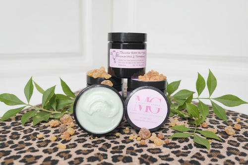 Cosmetic products on a leopard print surface with green leaves