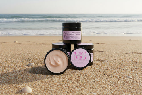 Jars of cream on a sandy beach with ocean waves in the background