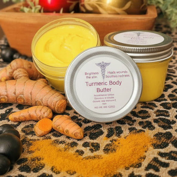 Turmeric body butter with turmeric root and black beads on a leopard print cloth.