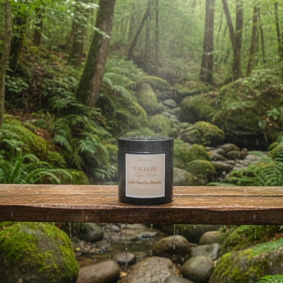 Jar of tallow sugar scrub on a wooden surface with a tree background